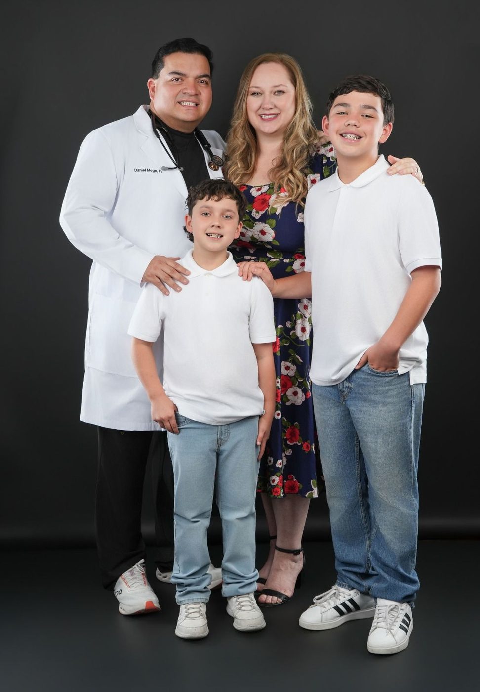 Daniel Mego with his wife and two sons